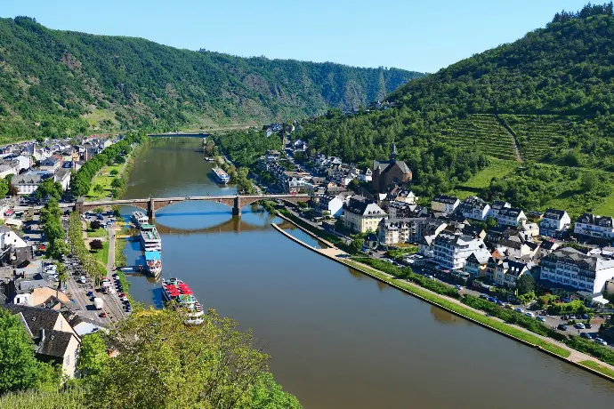 A river running through a lush green hillside